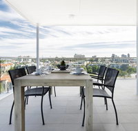 Minimalist Penthouse Condo with Skyline Vistas - Holiday Cairns