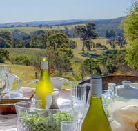 The Farmhouse - grape vines and rolling green hills - Holiday Cairns