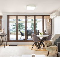 Beachfront Manly Apartment With Parking and Balcony - Holiday Cairns