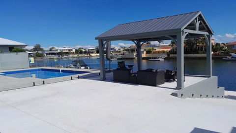 Relax Poolside By The Canal - Holiday Cairns 1